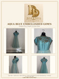 Introducing the Meadow Aqua Embroidered Dress, a pale aqua blue dress with intricate embroidery and subtle sequin detailing. It features a fitted bodice with one-quarter length sleeves and a flowing A-line silhouette. Recommended for parties, receptions, and non-Indian occasions too.
